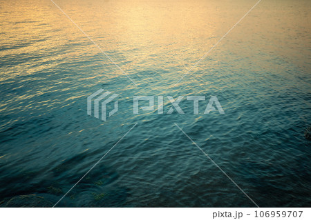 Top view of seawater at sunset. Abstract nature landscape background. Gradient color 106959707