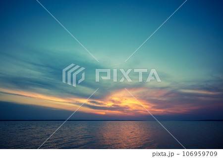 Seascape in the early morning. Sunrise over the sea. Calm sea with beautiful sky. Nature landscape Seascape in the early morning. Sunrise over the sea. Calm sea with beautiful sky. Nature landscape 106959709