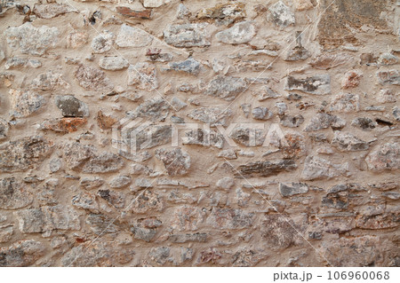 Sturdy yellow and beige cut stone wall made in Datca, Turkey, seamless lined up Sturdy yellow and beige cut stone wall made in Datca, Turkey, seamless lined up 106960068