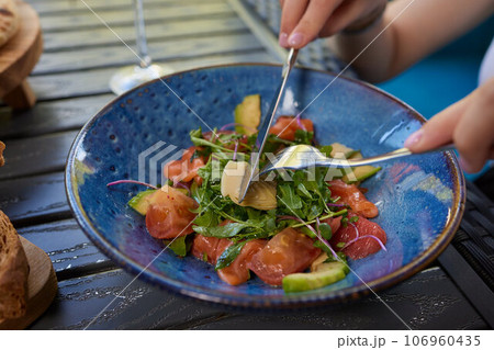 Young woman eating healthy salad at restuarant, Healthy lifestyle, diet concept. Young woman eating healthy salad at restuarant, Healthy lifestyle, diet concept. 106960435