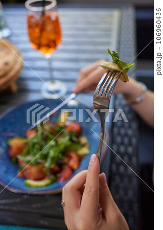 Young woman eating healthy salad at restuarant, Healthy lifestyle, diet concept. Young woman eating healthy salad at restuarant, Healthy lifestyle, diet concept. 106960436