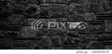 Sturdy black and white cut stone wall made in Datca, Turkey, seamless lined up Sturdy black and white cut stone wall made in Datca, Turkey, seamless lined up 106960676