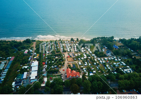 Aerial view of campsite with trailers near Baltic sea beach in Wladyslawowo, Poland. Tourists have rest during summer vacation season 106960863