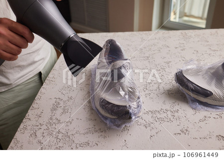 vacuum packing sneakers. for seasonal storage close-up. vacuum packing sneakers. for seasonal storage close-up. 106961449