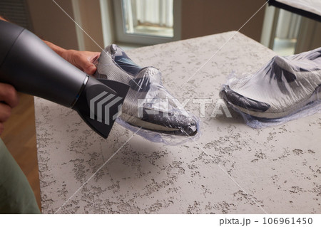 vacuum packing sneakers. for seasonal storage close-up. 106961450