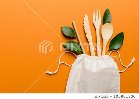 Eco friendly reusable recyclable white eco bag with kitchenware on Colored background. Concept zero waste 106961506