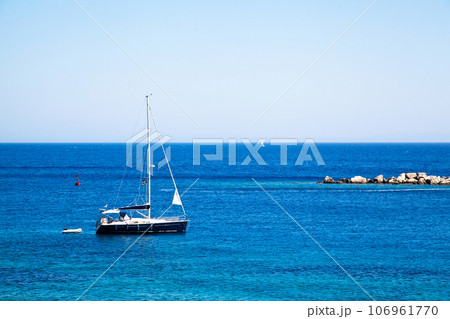 Yachts and ships waiting at the ancient city port of Knidos are on vacation.Turkey Mugla Datca, June 28 2023 Yachts and ships waiting at the ancient city port of Knidos are on vacation.Turkey Mugla Datca, June 28 2023 106961770