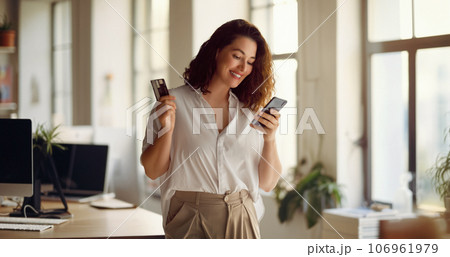 Woman is doing online purchases Woman is doing online purchases 106961979