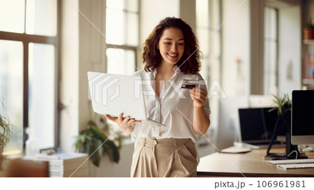 Woman is doing online purchases 106961981