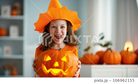 girl with carving pumpkin girl with carving pumpkin 106962155