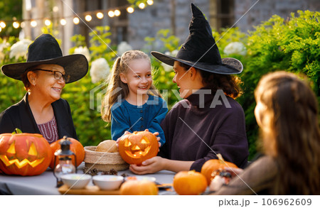 family preparing for Halloween 106962609