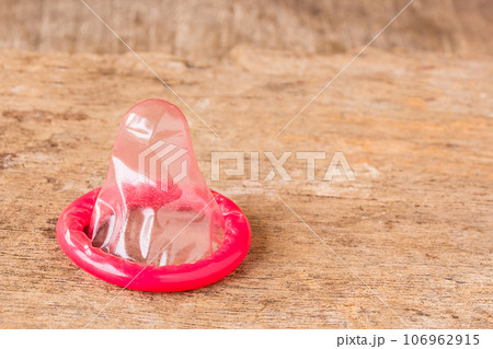 Close up condom on wooden table Close up condom on wooden table 106962915