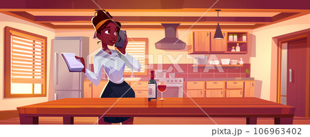 Woman with notebook talking on phone in kitchen. 106963402