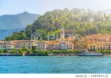 Bellagio town at Como Lake on sunny summer day. Idyllic view from ferry. Lombardy, Italy Bellagio town at Como Lake on sunny summer day. Idyllic view from ferry. Lombardy, Italy 106964129