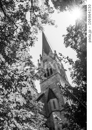 Cathedral of St. Florin, neo-gothic church in Vaduz, Liechtenstein. Black and white photography. Cathedral of St. Florin, neo-gothic church in Vaduz, Liechtenstein. Black and white photography. 106964130