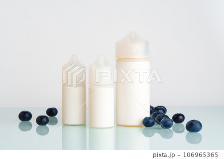Vape smoking liquid with berry flavor close up 106965365