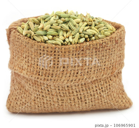 Fennel seeds over white background Fennel seeds over white background 106965901