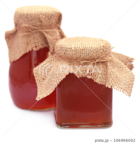 Honey in glass jar 106966082
