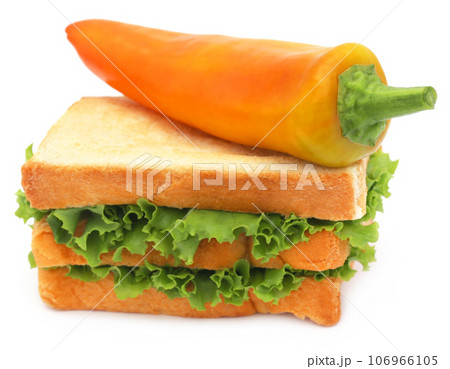 Bread slices with banana pepper and green lettuce inside 106966105