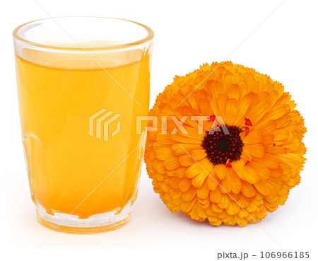 Herbal calendula flower with extract in a glass Herbal calendula flower with extract in a glass 106966185
