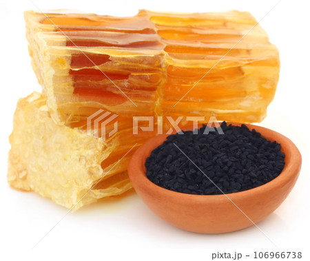 Honey with black cumin in a pottery 106966738