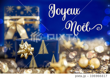 Text Joyeux Noel, Means Merry Christmas, Golden And Blue Christmas Decoration Text Joyeux Noel, Means Merry Christmas, Golden And Blue Christmas Decoration 106966817