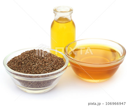 Ajwain seeds in a glass bowl with essential oil Ajwain seeds in a glass bowl with essential oil 106966947