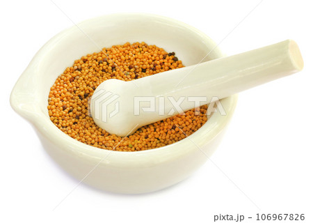 Mustard in a mortar with pestle 106967826