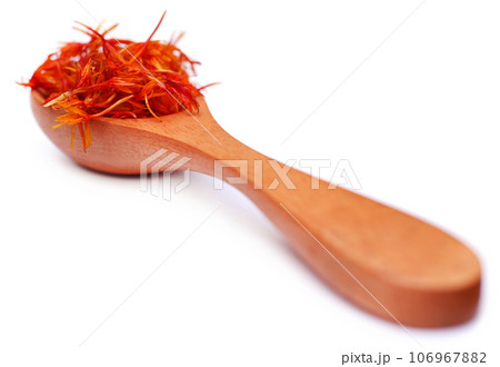 Safflower in a wooden spoon Safflower in a wooden spoon 106967882