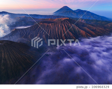 Amazing Mount Bromo volcano during sunrise from king kong viewpoint on Mountain Penanjakan in Bromo Tengger Semeru National Park,East Java,Indonesia.Nature landscape background Amazing Mount Bromo volcano during sunrise from king kong viewpoint on Mountain Penanjakan in Bromo Tengger Semeru National Park,East Java,Indonesia.Nature landscape background 106968329
