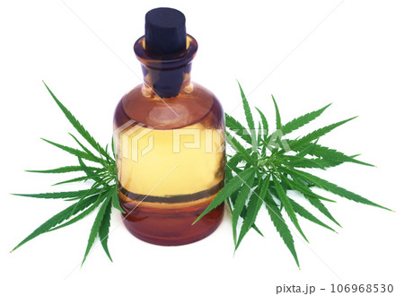 Medicinal cannabis leaves with extract oil in a bottle 106968530