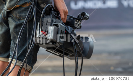 Close up Professional videographer on event, videographer filmmaker cinematographer camera, Filmmaking, videography. Close up Professional videographer on event, videographer filmmaker cinematographer camera, Filmmaking, videography. 106970785