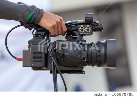 Close up Professional videographer on event, videographer filmmaker cinematographer camera, Filmmaking, videography. 106970786