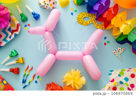 Birthday concept - celebration attributes on blight background Birthday concept - celebration attributes on blight background 106970869