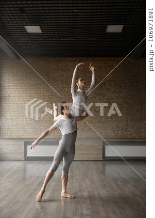Artists graceful dance movement, ballet dancers performing beautiful action 106971891