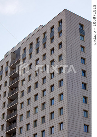 Windows of upper floors of high building 106971918