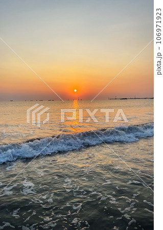 Wave on the sea at sunset closeup 106971923