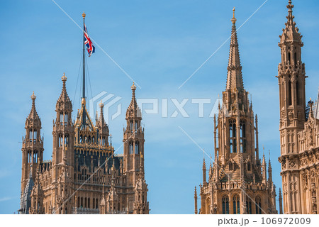 Big Ben, Westminster Bridge on River Thames in London, the UK. English symbol. Lovely puffy clouds, sunny day 106972009