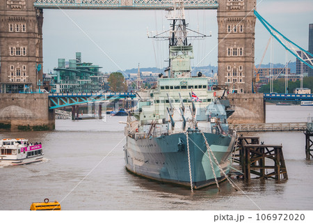Iconic Tower Bridge connecting Londong with Southwark on the Thames River. Close up view of the HMS Belfast Iconic Tower Bridge connecting Londong with Southwark on the Thames River. Close up view of the HMS Belfast 106972020