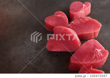 Large chunks of tuna steak. Fresh tuna. Healthy food. Natural omega. Selective focus.Copy space. Large chunks of tuna steak. Fresh tuna. Healthy food. Natural omega. Selective focus.Copy space. 106972087