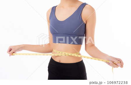 Portrait beautiful young asian woman measure tape with waist for weightloss with satisfied. 106972238