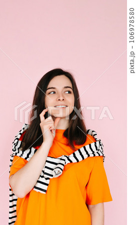 Captivating Daydreamer: Enchanting Woman with Finger in Mouth, Lost in Thought, Gazing into Empty 106978580