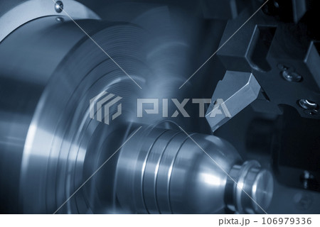The CNC lathe machine forming cutting the metal shaft parts. The CNC lathe machine forming cutting the metal shaft parts. 106979336