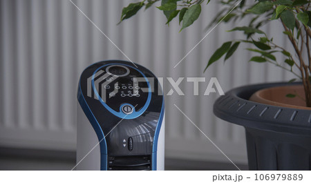 portable air conditioning in a living room.The air conditioner is an incredibly useful device in any home.economy concept 106979889