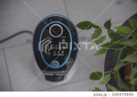 portable air conditioning in a living room.The air conditioner is an incredibly useful device in any home.economy concept 106979890