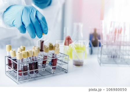Researchers test blood samples in the laboratory. Researchers are inventing vaccines to treat COVID-19 virus. Researchers test blood samples in the laboratory. Researchers are inventing vaccines to treat COVID-19 virus. 106980050