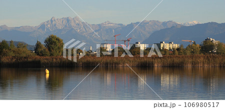 Wetzikon, town in Zurich Canton, shore of Lake Pfaeffikersee and mountain ranges. 106980517