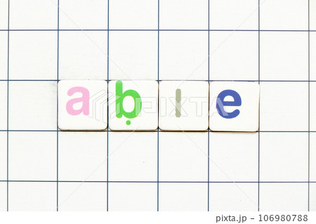 Colorful tile letter in word able on white grid background 106980788