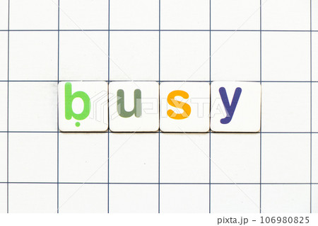 Colorful tile letter in word busy on white grid background Colorful tile letter in word busy on white grid background 106980825