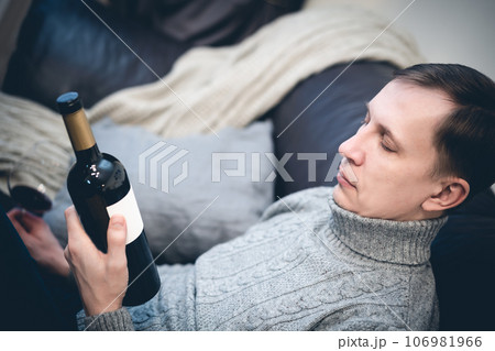 Man holding a wine bottle Man holding a wine bottle 106981966